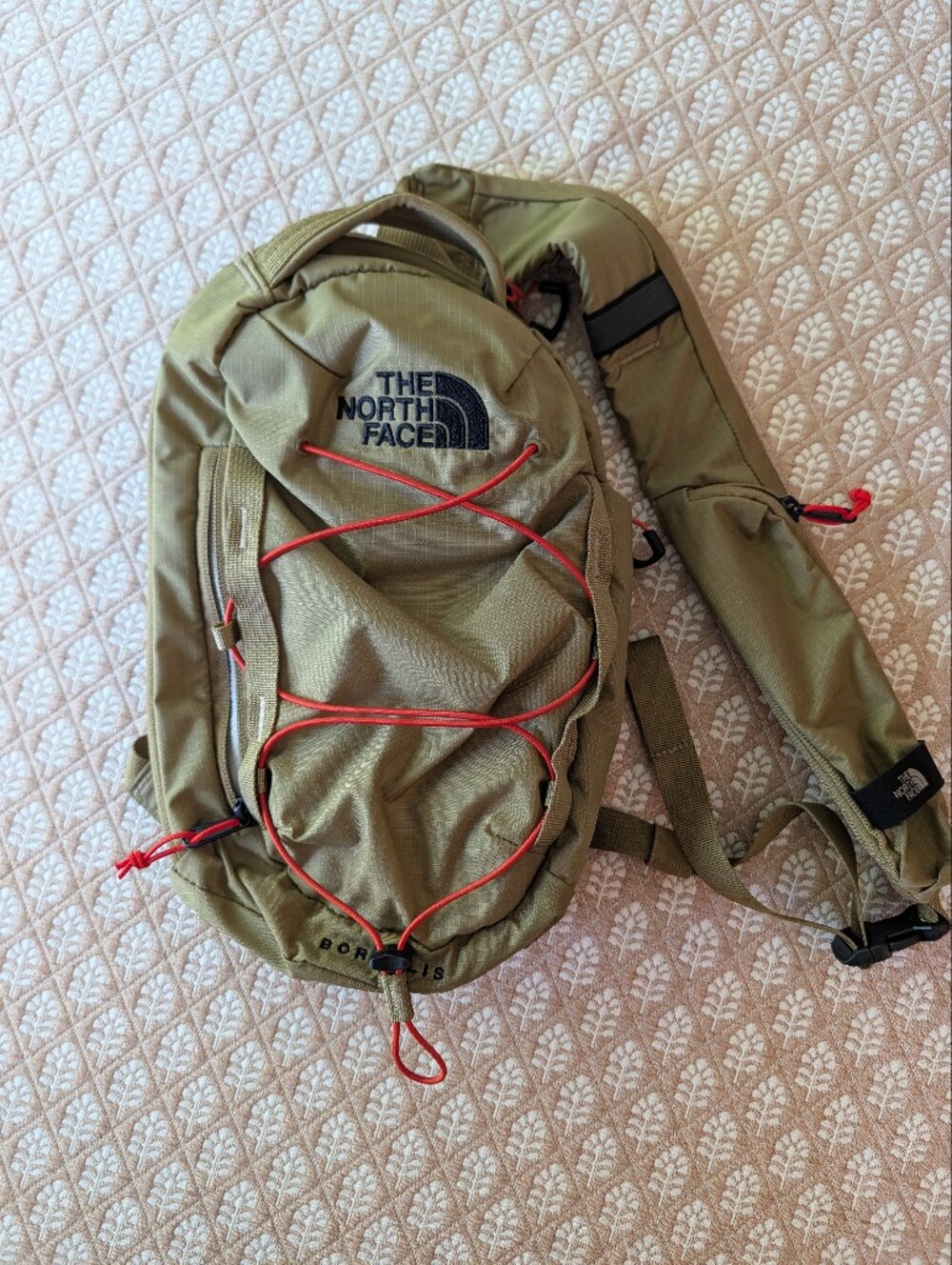 The North Face Olive Green Sling Backpack with Red Bungee